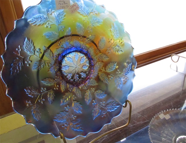 Carnival glass with a pattern of blue leaves